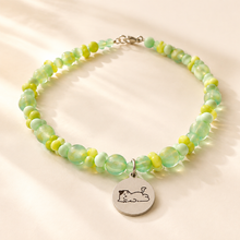 Personalized green beaded pet necklace with engraved ID tag